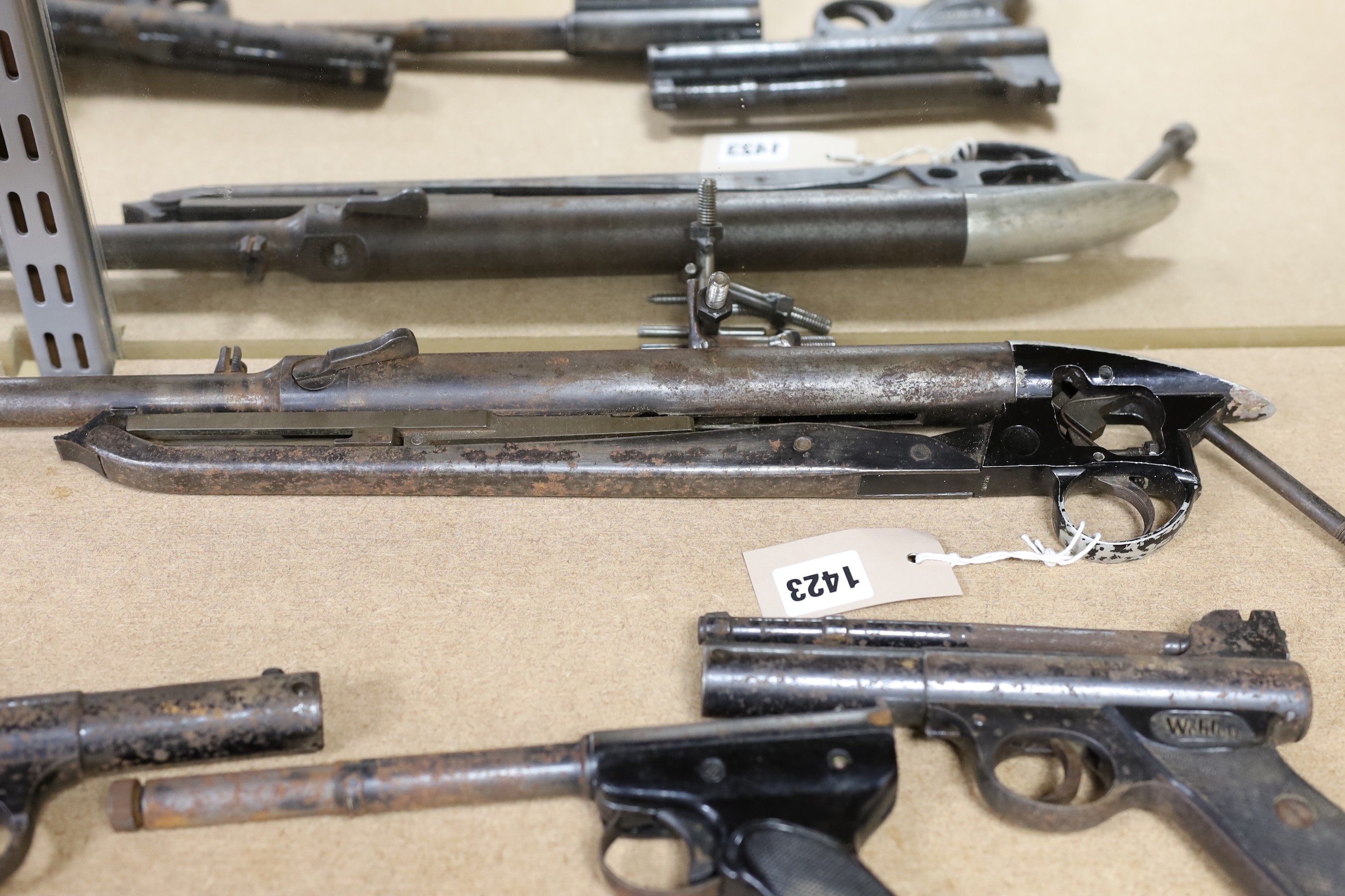 Two Webley air pistols, another, an air rifle and a part rifle